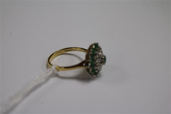 An 18ct gold, emerald and diamond cluster dress ring, size N.
